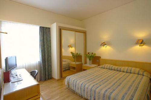 Hotel (Aquila ) Rithymna Beach junior suite bedroom.jpg